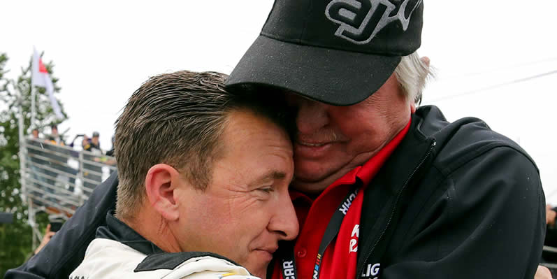 AJ Allmendinger is embraced by his father