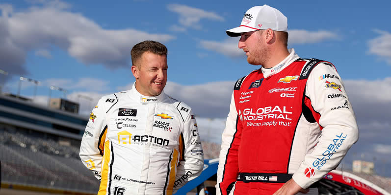 AJ Allmendinger and Austin Hill talk on the grid during qualifying