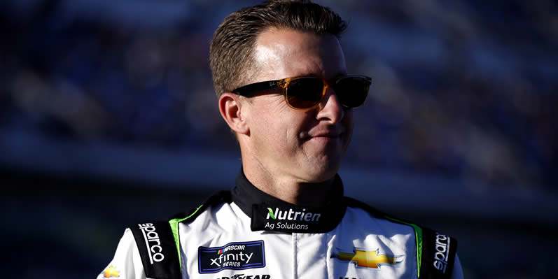 AJ Allmendinger waits on the grid