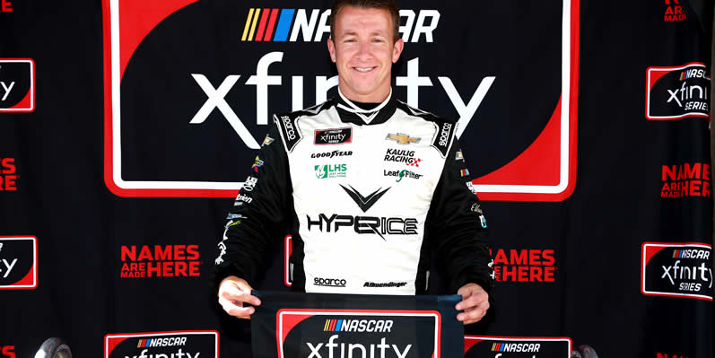 AJ Allmendinger poses after winning pole award