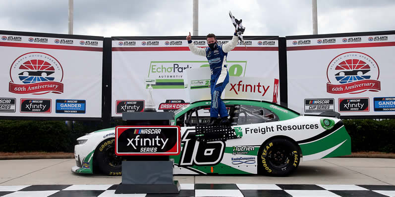 AJ Allmendinger celebrates in Victory Lane