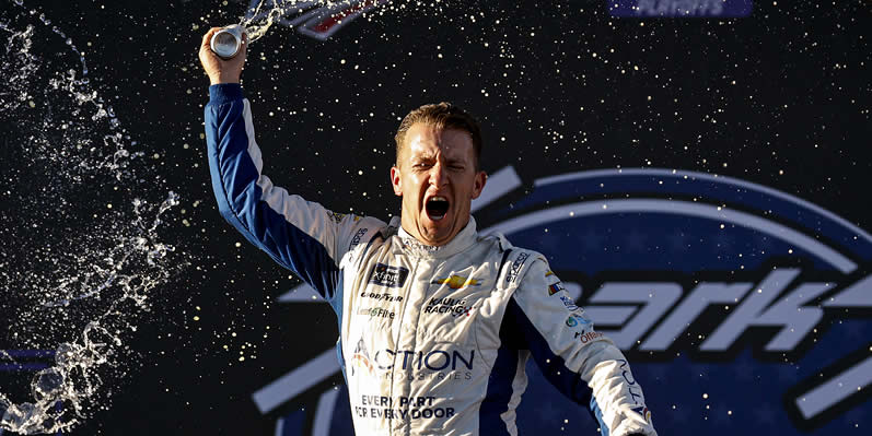 AJ Allmendinger celebrates in victory lane