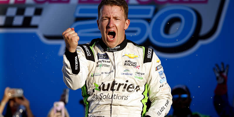 AJ Allmendinger celebrates in victory lane