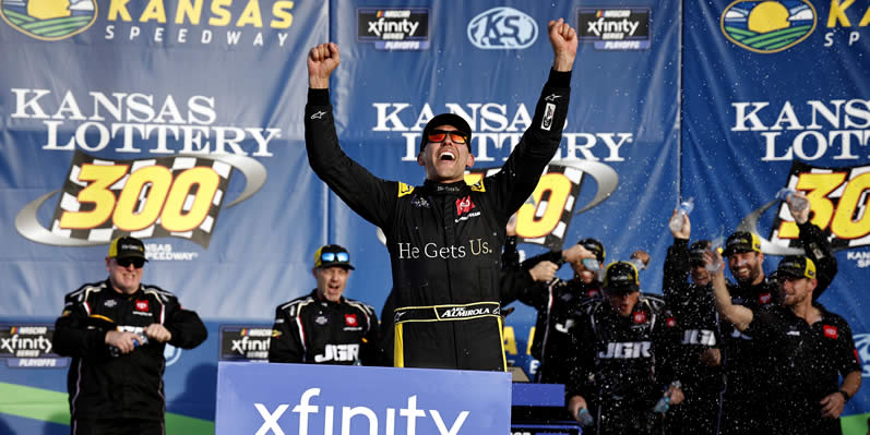 Aric Almirola celebrates in victory lane after winning