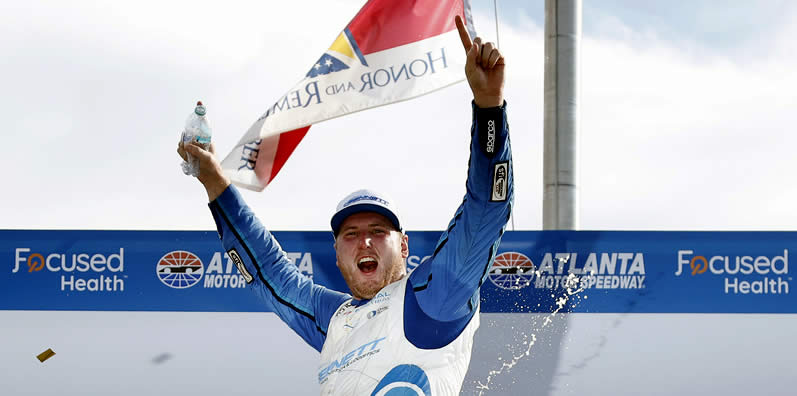 Austin Hill celebrates in victory lane