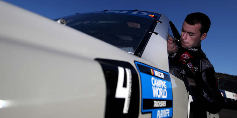 Ben Rhodes enters his truck to practice