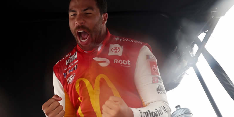 Bubba Wallace celebrates in the pit area after winning