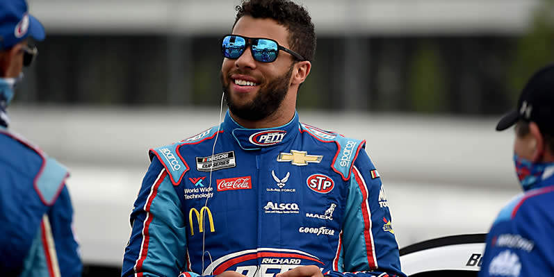 Bubba Wallace waits on the grid