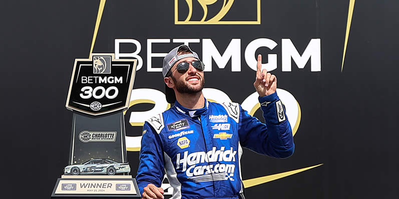 Chase Elliott celebrates in victory lane