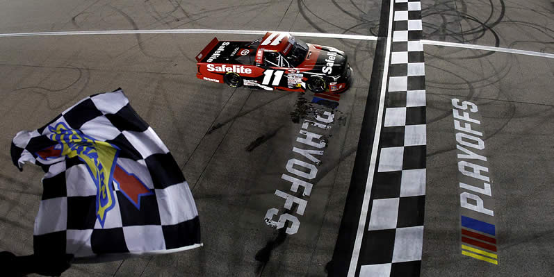 Corey Heim takes the checkered flag to win