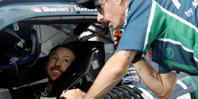 Daniel Hemric speaks with a crew member during practice