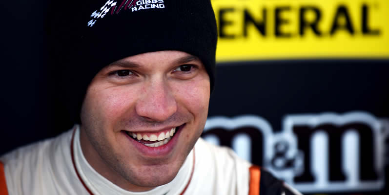 Daniel Suarez stands in the garage area