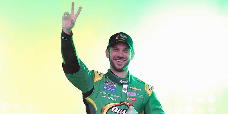 Daniel Suarez waves to fans