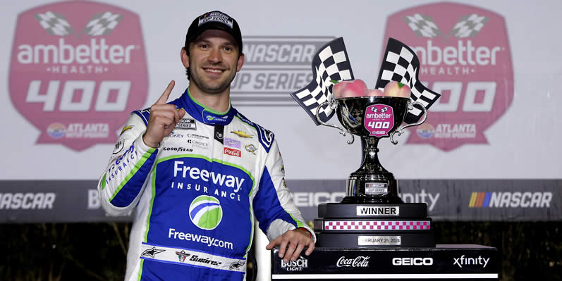 Daniel Suarez celebrates in victory lane