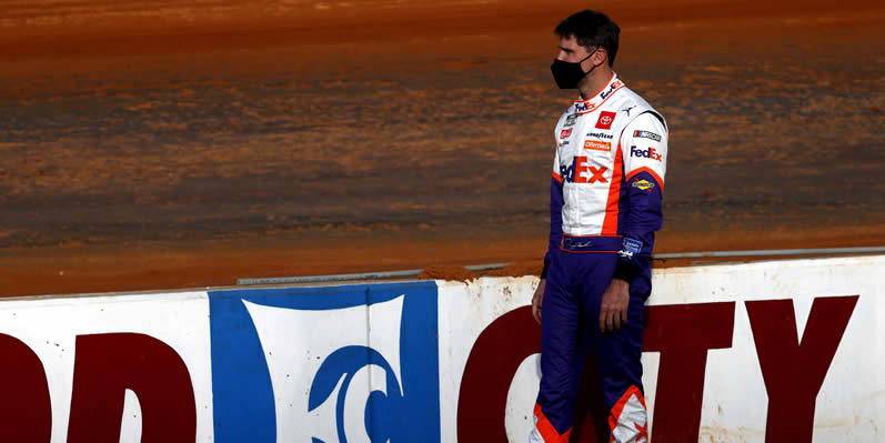 Denny Hamlin looks on during practice