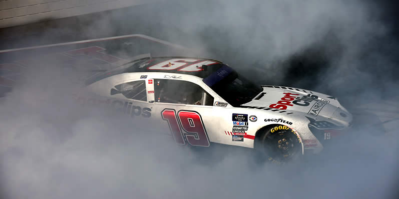 Denny Hamlin celebrates with a burnout