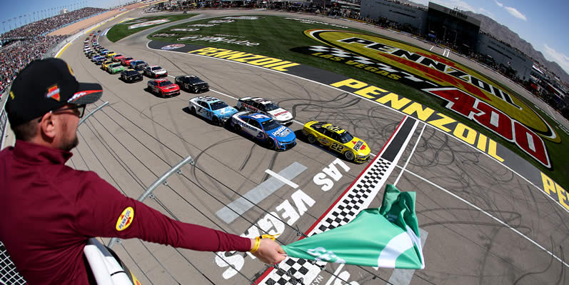 Joey Logano leads the field to the green flag