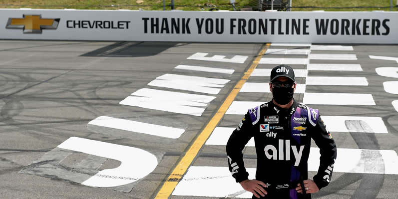 Jimmie Johnson poses on the Start/Finish line