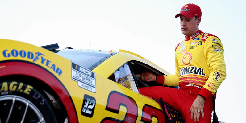 Joey Logano exits his car