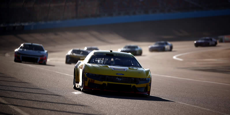 Joey Logano drives during practice