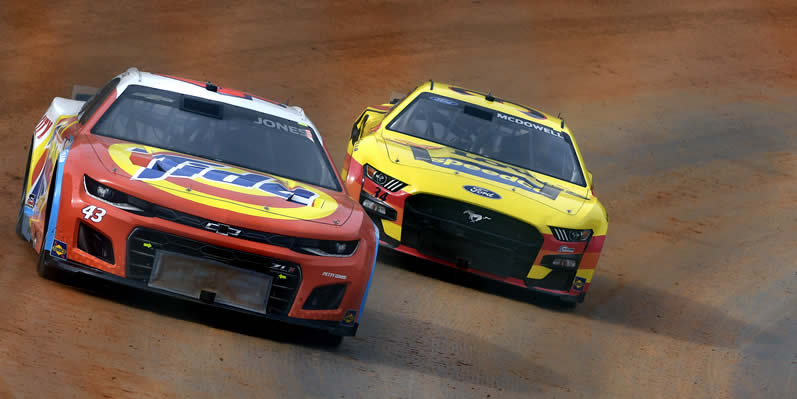  Erik Jones and Michael McDowell drives during first practice