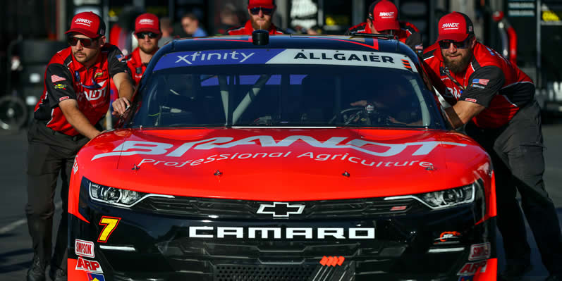 Crew members push the #7 BRANDT Foundation Chevrolet