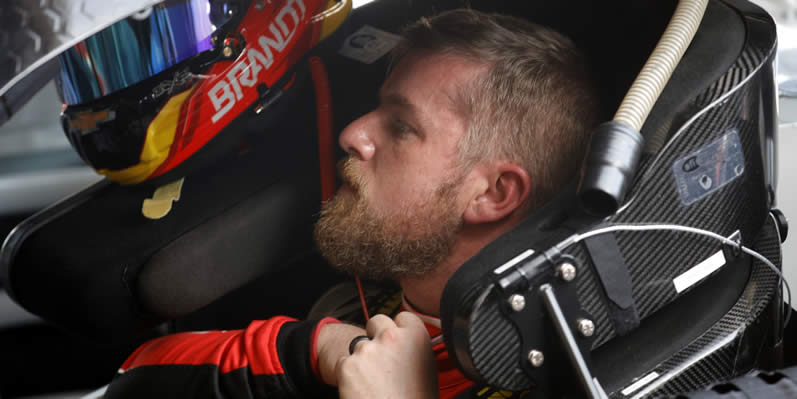 Justin Allgaier sits in his car