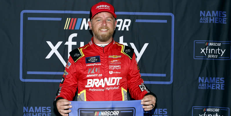 Justin Allgaier poses for photos