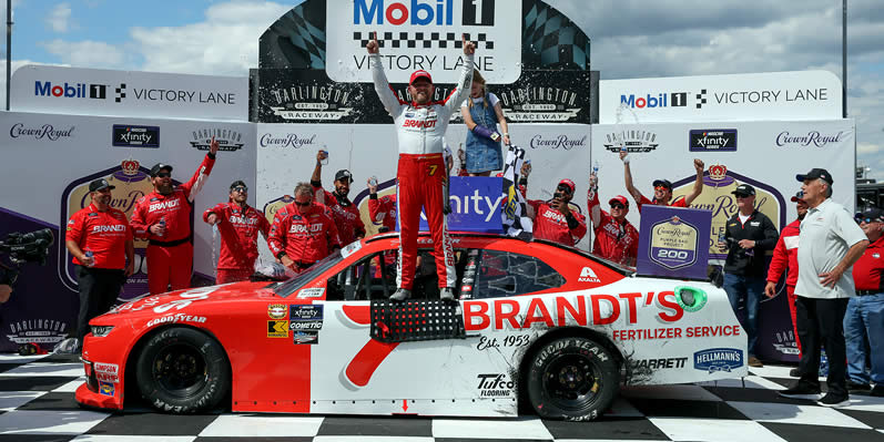  Justin Allgaier celebrates in victory lane