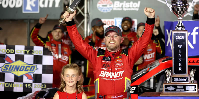 Justin Allgaier celebrates with his daughter in victory lane