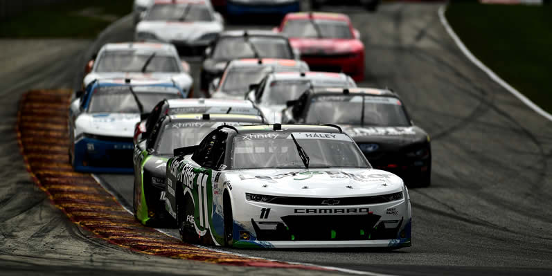 Justin Haley leads a pack of cars