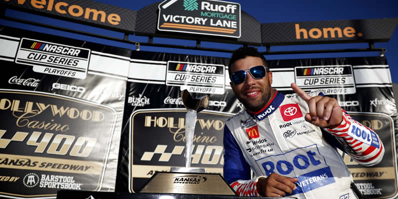 Bubba Wallace celebrates in victory lane