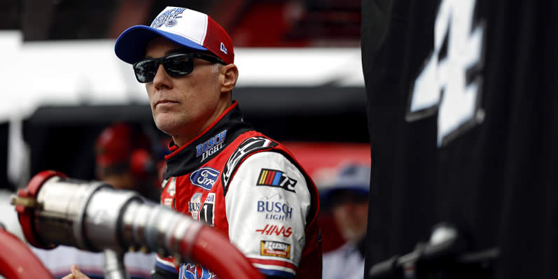 Kevin Harvick looks on from the garage area during practice