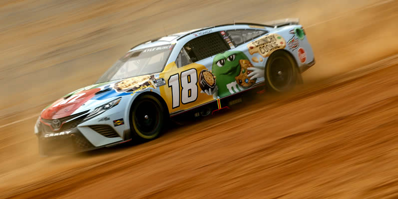 Kyle Busch drives during first practice