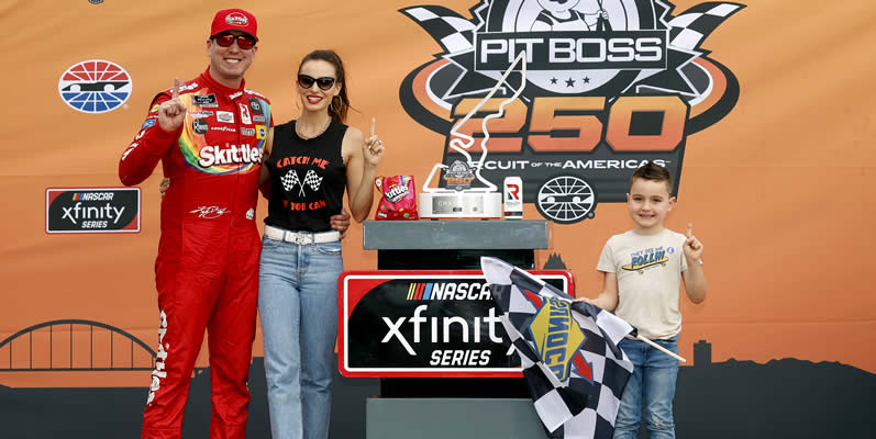 Kyle Busch celebrates in victory lane