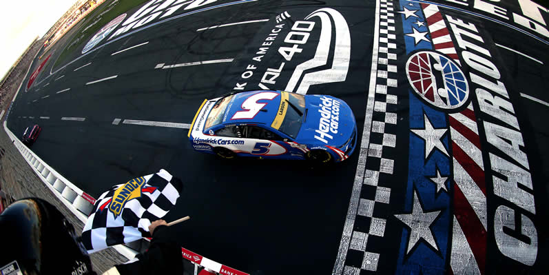 Kyle Larson crosses the finish line to take the checkered flag