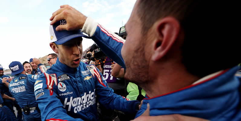 Crew chief Cliff Daniels and Kyle Larson celebrate