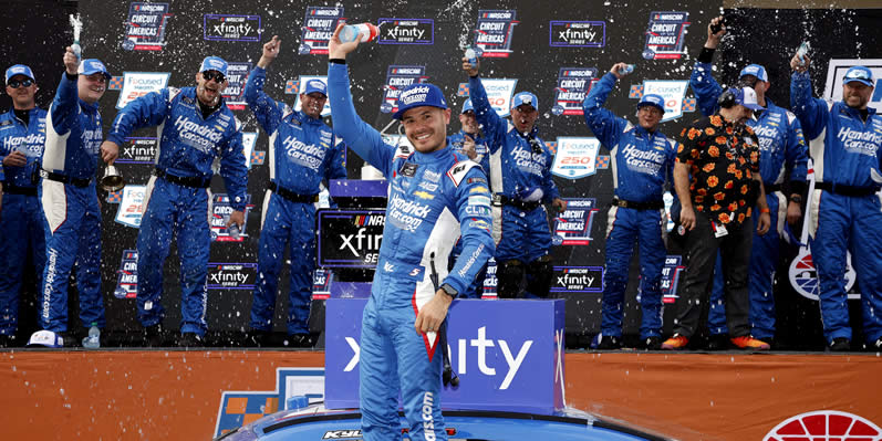 Kyle Larson celebrates in victory lane