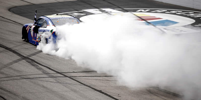 Kyle Larson celebrates with a burnout