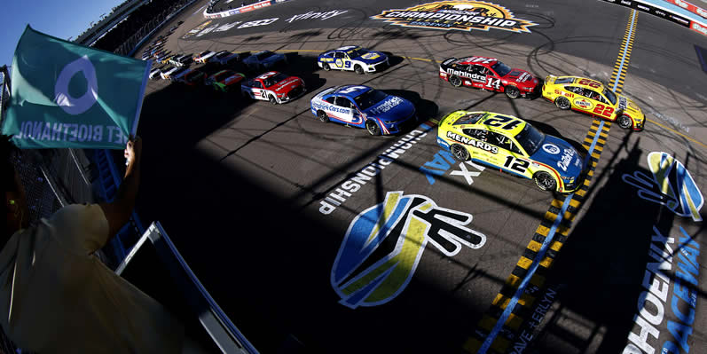 Joey Logano leads the field to the green flag