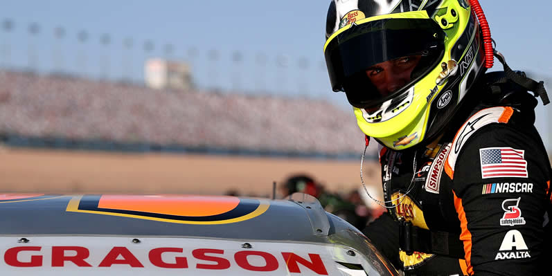 Noah Gragson enters his car at Las Vegas Motor Speedway