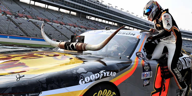 Noah Gragson enters his car during qualifying