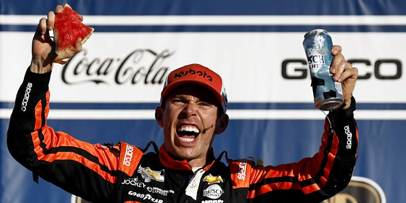 Ross Chastain celebrates in victory lane after winning