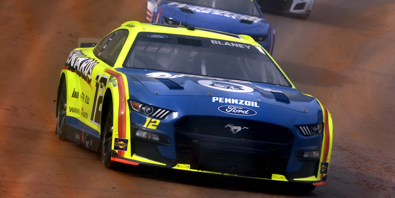 Ryan Blaney, Kyle Larson, and Chase Elliot drive during first practice