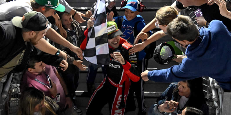 Ryan Blaney celebrates with fans after winning
