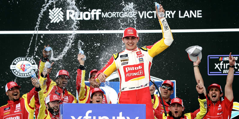 Sammy Smith celebrates in victory lane