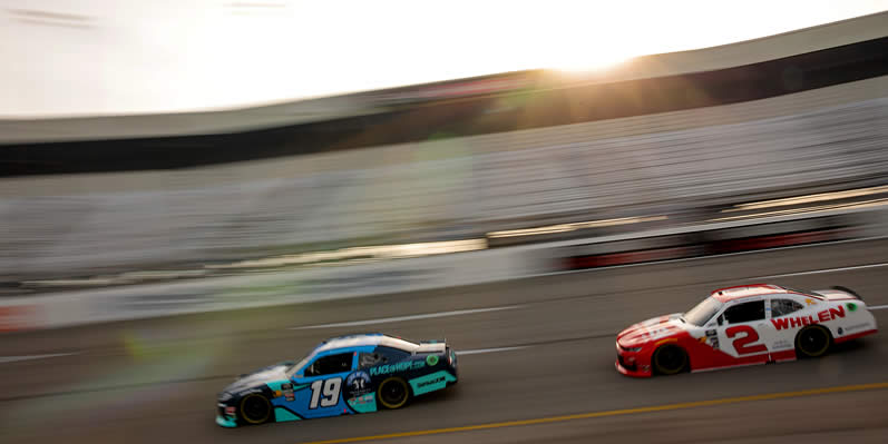 Taylor Gray and Jesse Love drive during practice