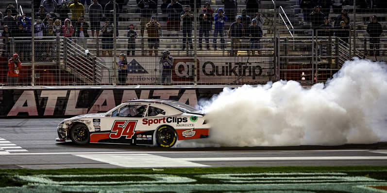 Ty Gibbs celebrates with a burnout