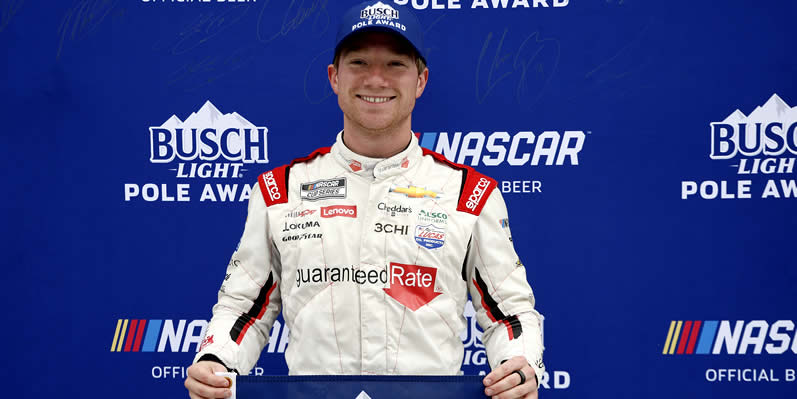 Tyler Reddick poses for photos after winning the pole award