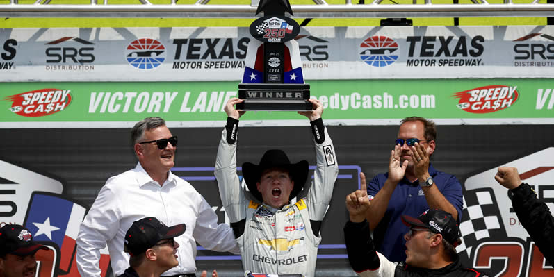 Tyler Reddick celebrates in victory lane